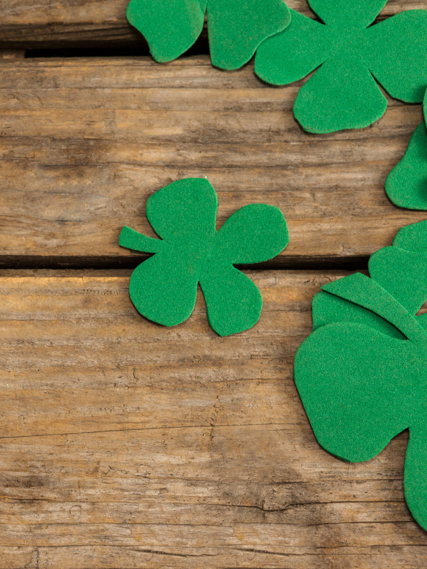 Dad pushing Daughter in Cardboard Box on Hardwood Floors